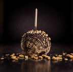 Chocolate peanut butter caramel apple with nut topping