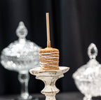A Caramallow is our signature oversized marshmallow confection, handcrafted with soft campfire marshmallow, buttery caramel, rich chocolate, and premium toppings.